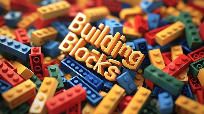 Hero Image that has the word Building Blocks and features lego type bricks in the background
